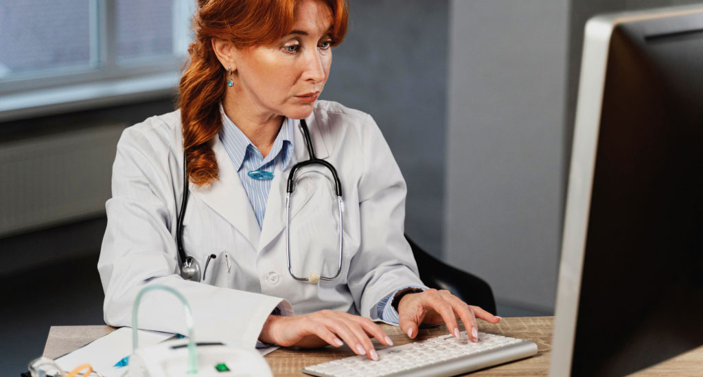 A woman working with EHR